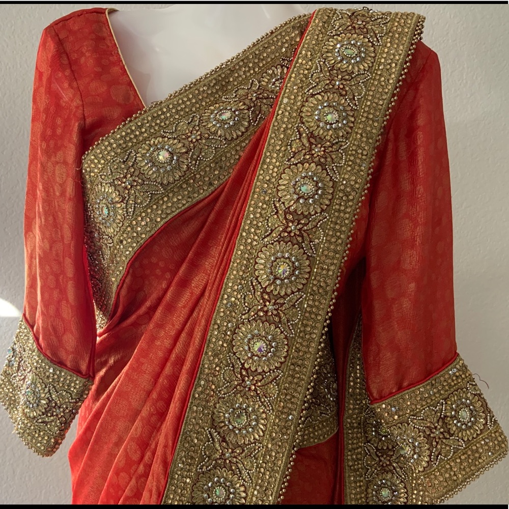 Orange Georgette Saree embedded with Stone